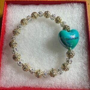 Tiffany & Co. Gold Bracelet with Teal Heart Charm